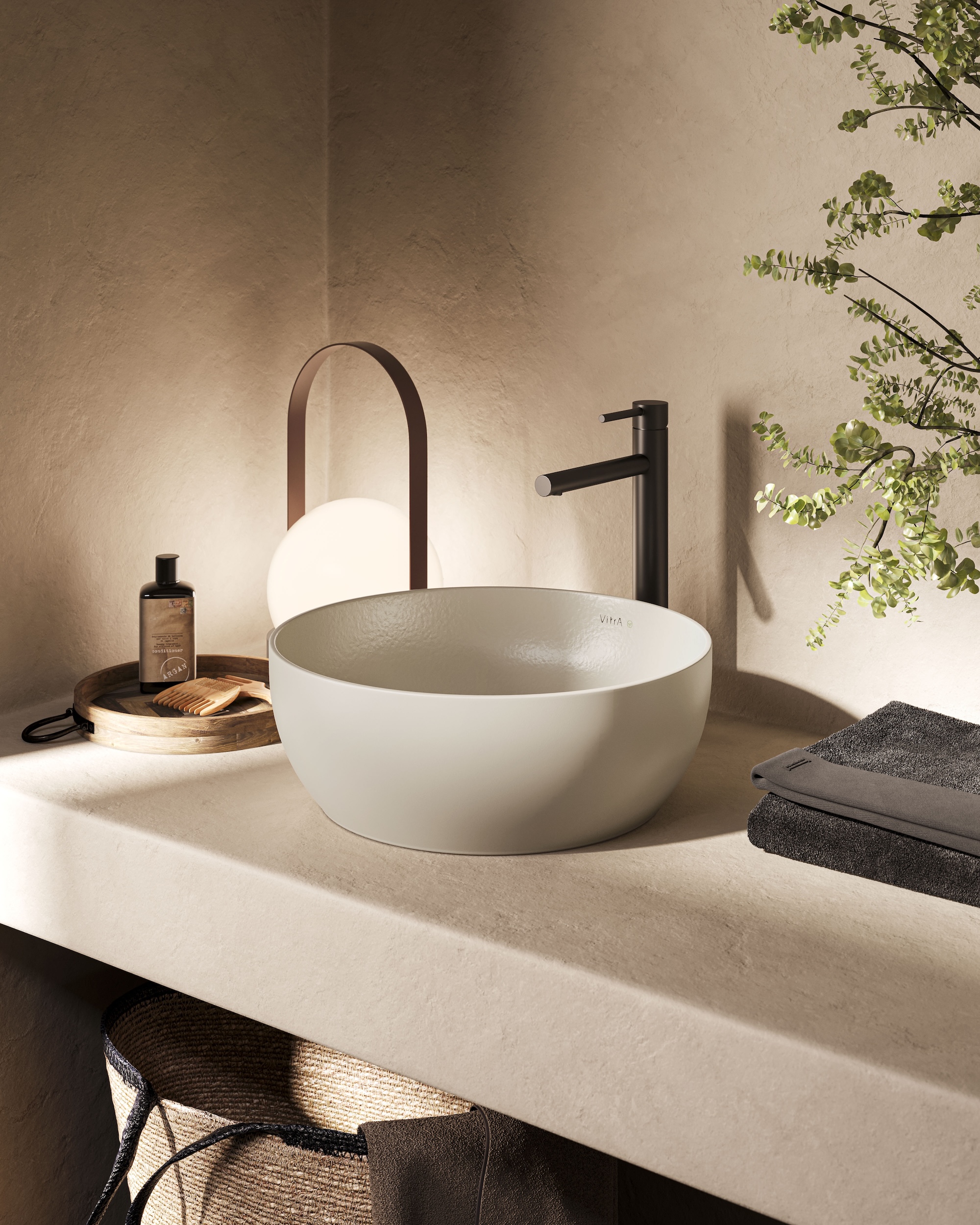 A recycled ceramic washbasin in a neutral bathroom setting