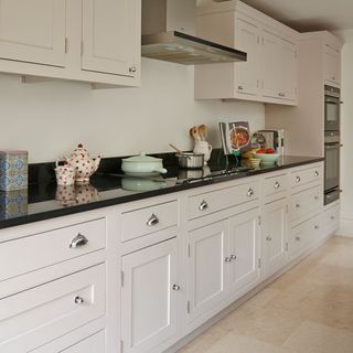 kitchen with kitchen cabinet teapot and chimney