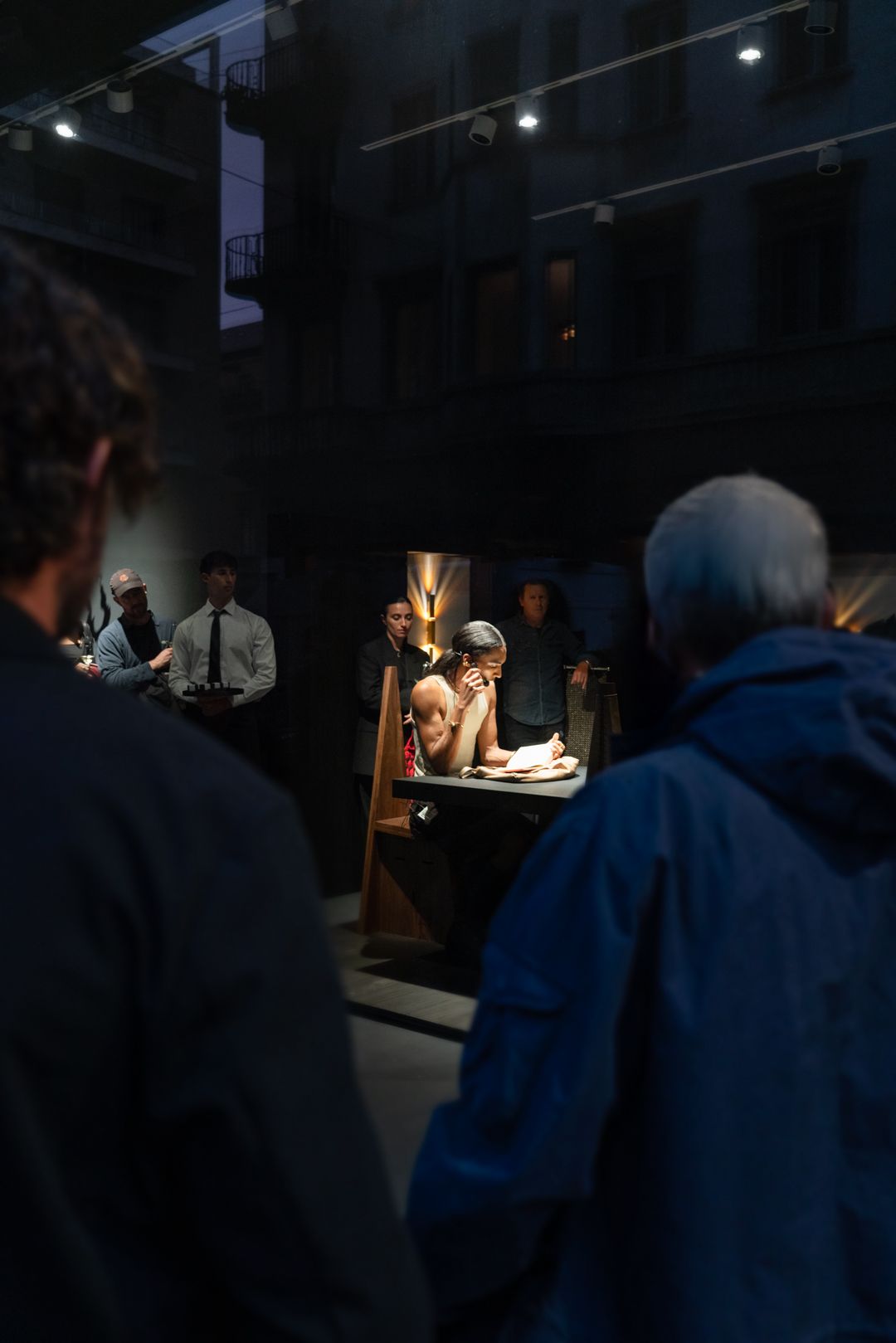 artwork displayed in black gallery space