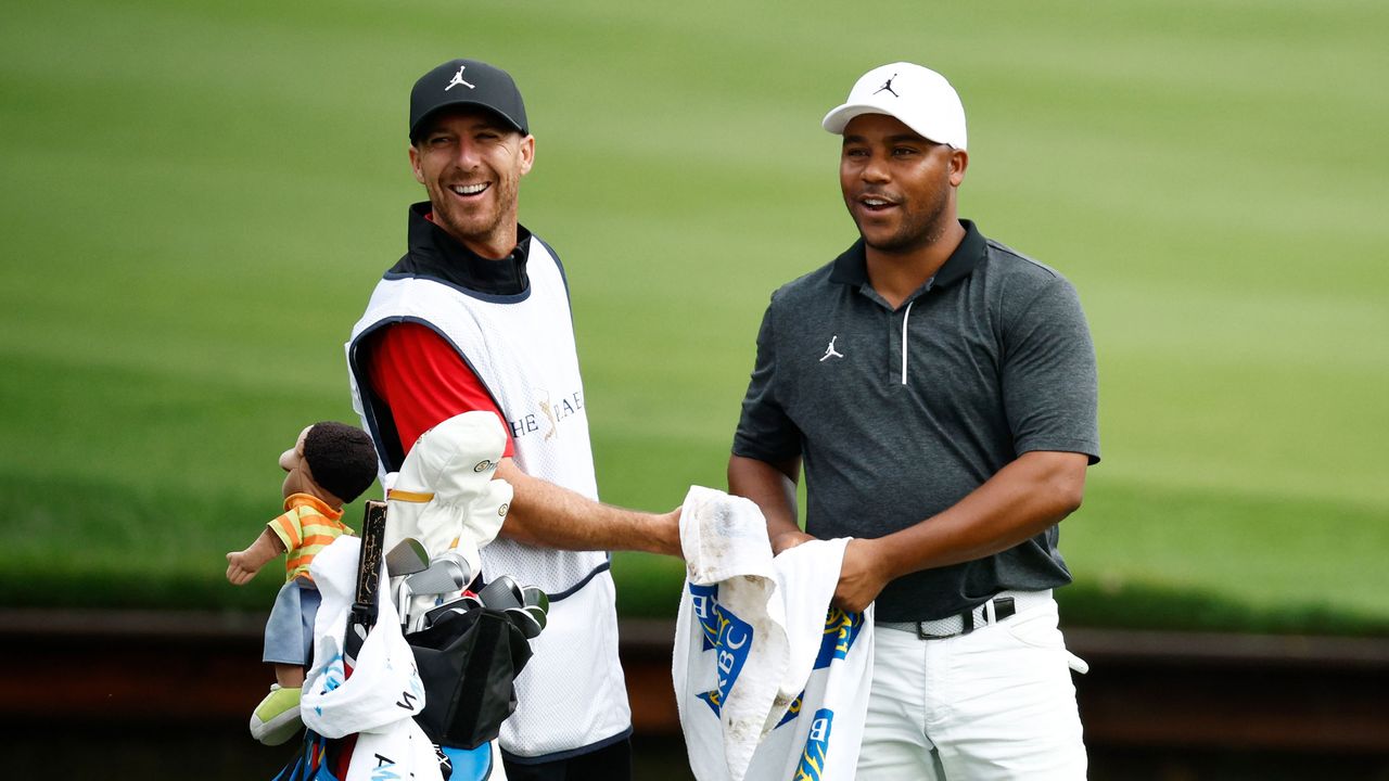 Harold Varner III and his caddie pictured