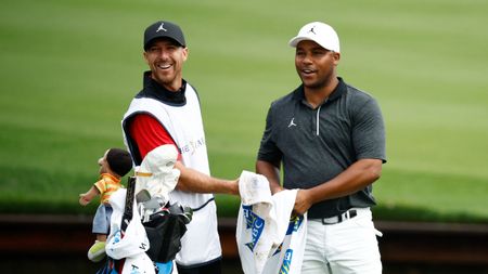 Harold Varner III and his caddie pictured