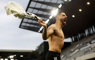 Aleksandar Mitrovic takes his shirt off to celebrate a goal