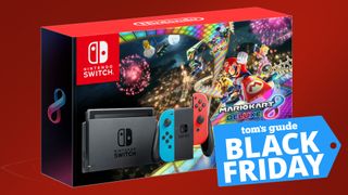 nintendo switch console and box on a red background. A label reads Tom's Guide Black Friday