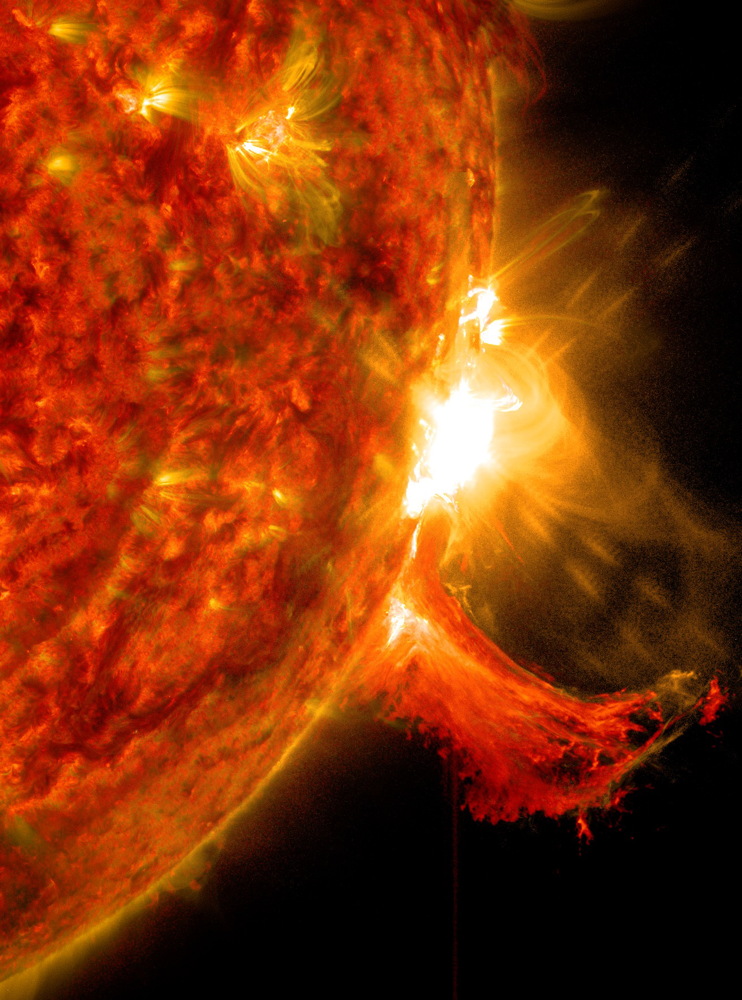 solar flares travel at the speed of light