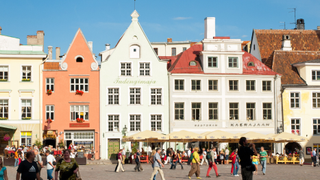 Colourful buildings and restaurants line Tallinn's Old Town square