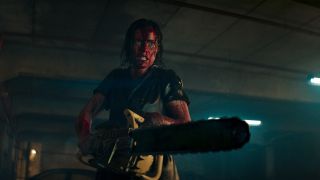 Beth (Lily Sullivan) with chainsaw in Evil Dead Rise