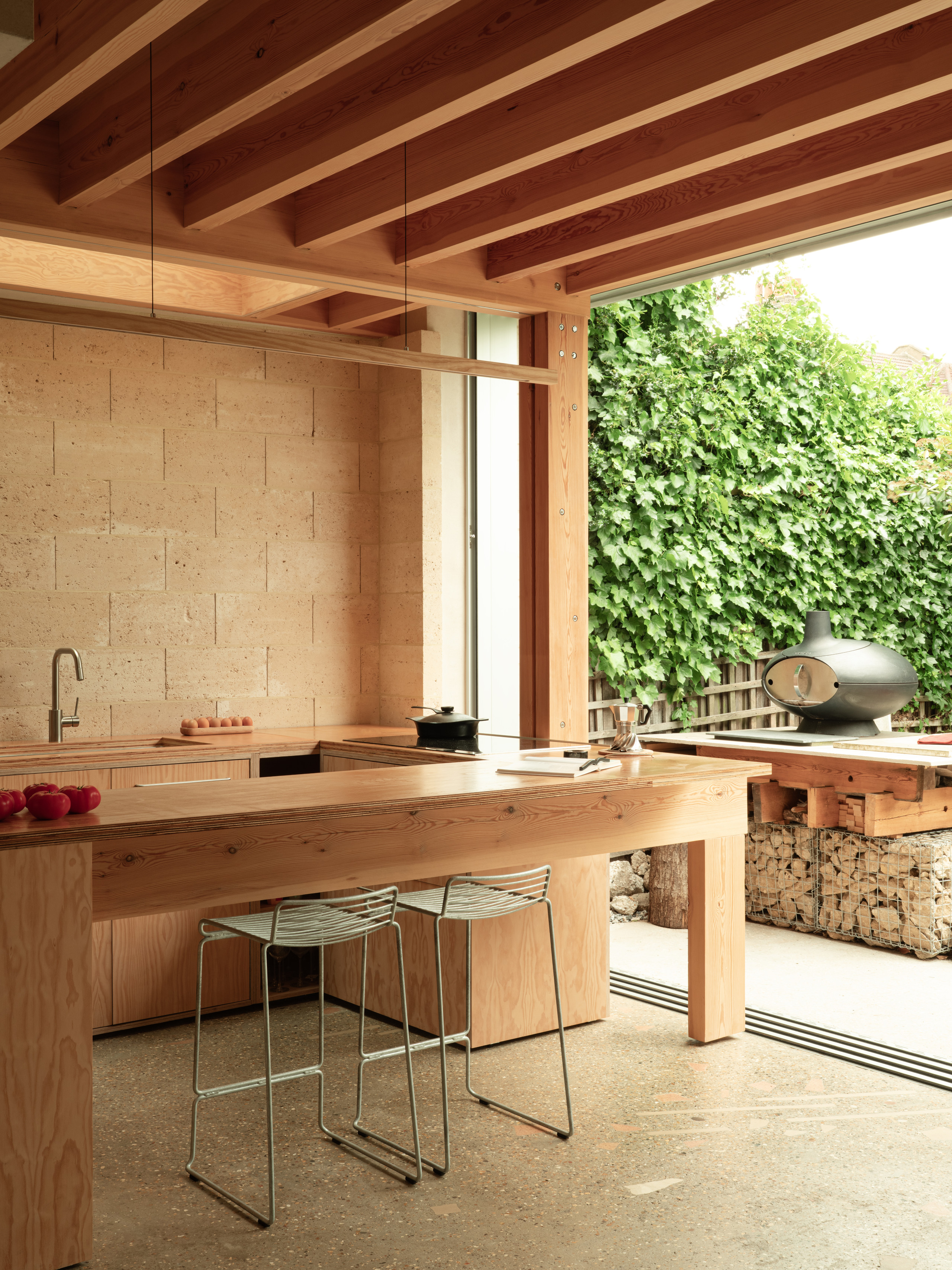 The new kitchen, with its experimental concrete floor and limestone block walls
