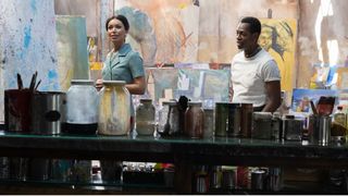 Ilfenesh Hadera and Eric Berryman as Mayme Johnson and Carvens Aldridge in a art studio in Godfather of Harlem season 3