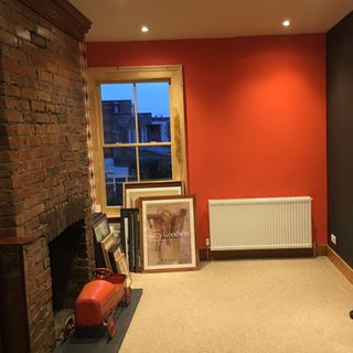 before shot of an empty room with red wall