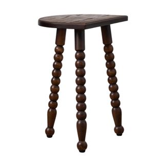 A dark wooden stool