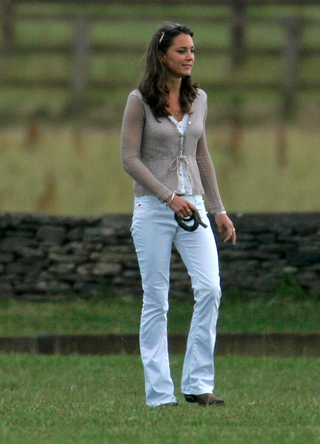 Kate Middleton watches Prince Harry and Prince William play in a charity polo match at the Beaufort Polo Club on July 29, 2006 in Tetbury, England