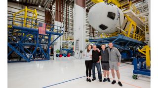 "Star Trek" actor William Shatner (second from left) poses for a crew photo with his NS-18 crewmates and their Blue Origin New Shepard rocket ahead of a planned Oct. 13, 2021 launch. His crewmates are: (from left) Audrey Powers of Blue Origin; Planet Labs co-founder Chris Boshuizen and Glen de Vries, co-founder of Medidata Solutions.