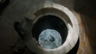 Littlefinger looks in the Moon Door in Game of Thrones.