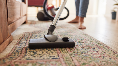 Close up of vacuum head on rug