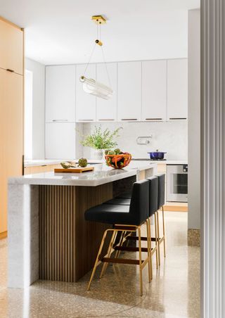 MKCA Architecture kitchen with marble waterfall countertop