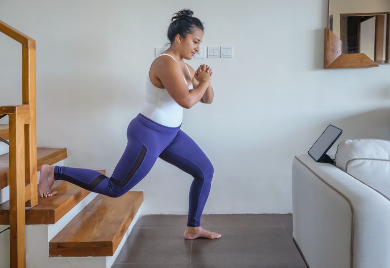 Woman workouts on her stairs