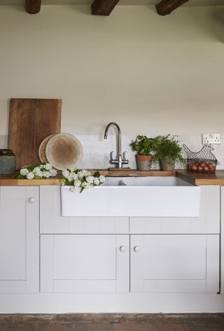butler's sink in kitchen in brick-and-flint house