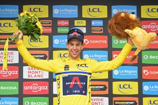 Team Ineos Richie Porte of Australia celebrates his overall leaders yellow jersey on the podium at the end of the eighth stage on the final day of the 73rd edition of the Criterium du Dauphine cycling race a 147km between La LechereLesBains and Les Gets on June 6 2021 Photo by Alain JOCARD AFP Photo by ALAIN JOCARDAFP via Getty Images