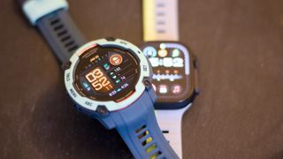 Garmin Instinct 3 next to the Apple Watch Ultra 2