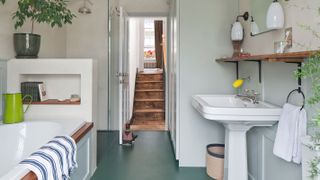 renovated bathroom with steps leading down