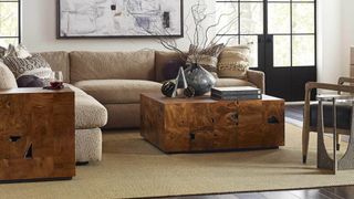living room with corner sofa, coffee table and large rug