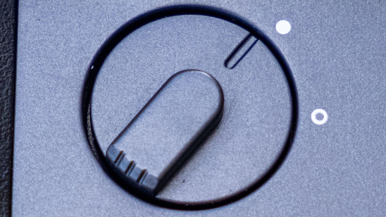 A close-up of the image-stabilization switch on the Fujifilm Techno-Stabi TS-L 1640 image-stabilized binoculars.