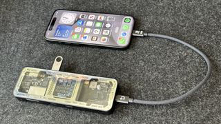iPhone 15 Pro plugged into a USB-C dock
