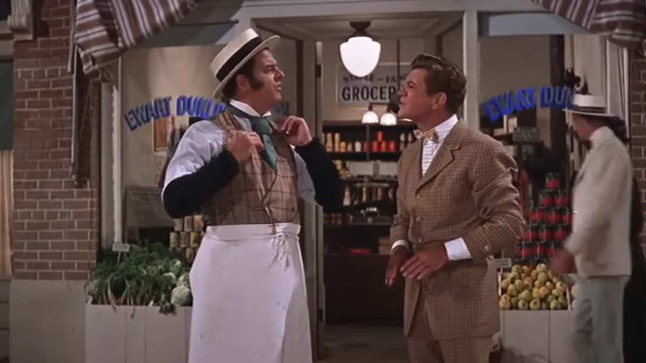 A scene between two men in The Music Man