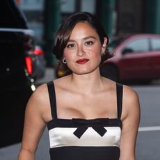 Chase Sui Wonders wearing a black mini dress, black pointed toe heels, and sheer socks in NYC