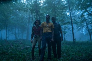 Atticus (Jonathan Majors), George (Courtney B. Vance) and Leti (Jurnee Smollett) in the woods in Lovecraft Country.