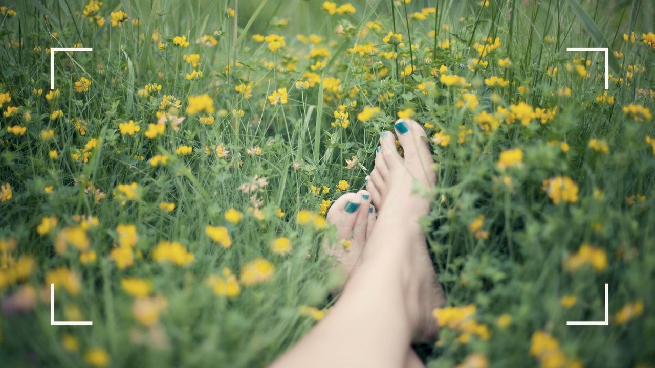 Image showing woman with smooth feet after she&#039;s learned to remove dead skin from feet