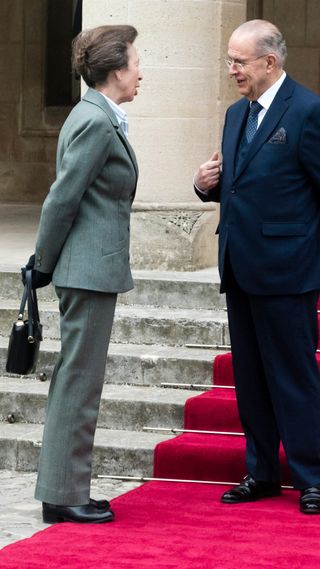 Britain's Princess Anne, Princess Royal, stands on the Red Carpet with Cypriot Foreign Minister Ioannis Kassoulides at the Presidential palace in Nicosia, during an official visit to the east Mediterranean island of Cyprus on January 11, 2023.