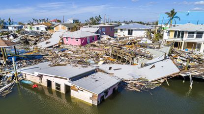 An aerial view shows hurricane-damaged property.