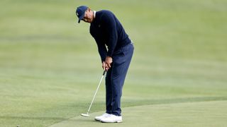 Tiger Woods of the United States putts on the second green during the first round of the The Genesis Invitational at Riviera Country Club on February 16, 2023 in Pacific Palisades, California.