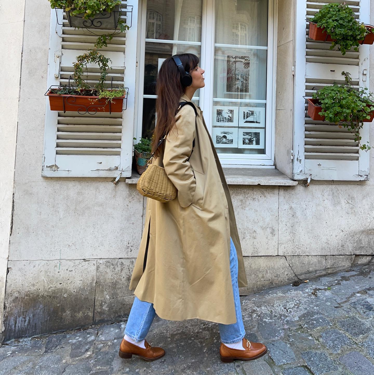 Influencer wears tan loafers.