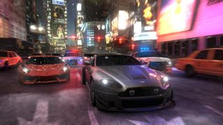 The Crew screenshot - sportscars racing through a nighttime city street