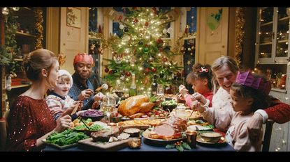 Family sitting around christmas table in Tesco christmas advert 