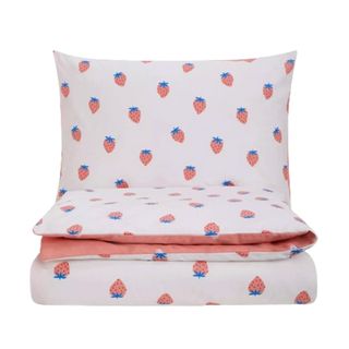 A kids bedding set with an all-over strawberry print