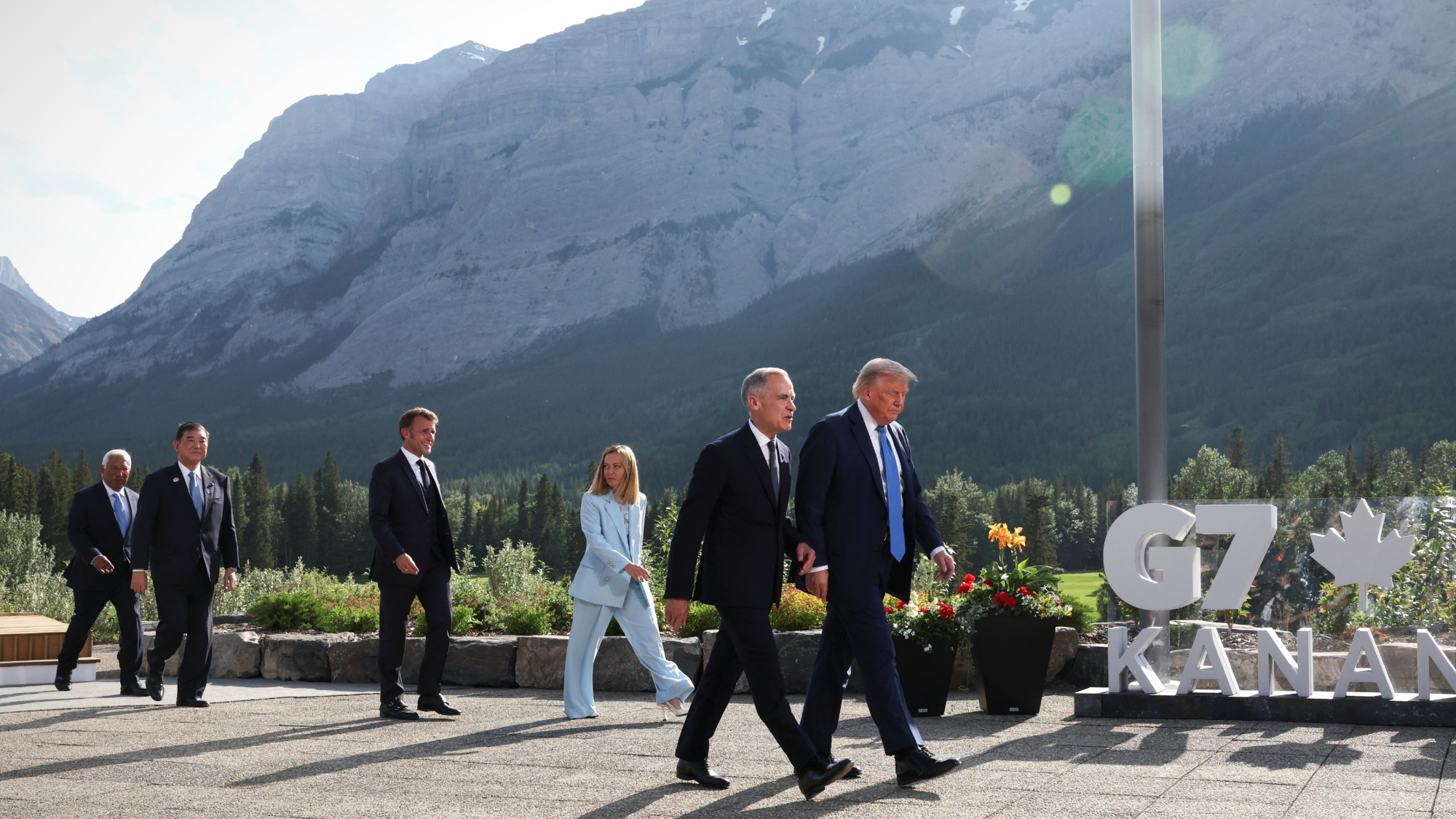 President Donald Trump and other G7 leaders leave group photo in Alberta, Canada