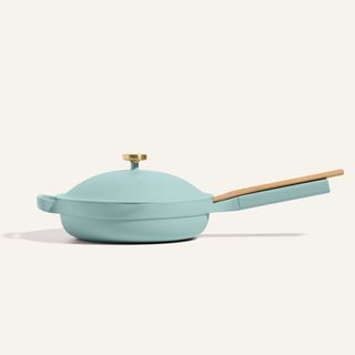 always pan in blue with a spatula balanced on top