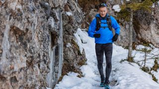 winter trail running gear: man winter running