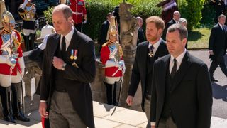 WINDSOR, ENGLAND - APRIL 17: Prince William, Duke of Cambridge, Prince Harry, Duke of Sussex and Peter Phillips follow The Duke of Edinburgh’s coffin into St George’s Chapel during the funeral of Prince Philip, Duke of Edinburgh at Windsor Castle on April 17, 2021 in Windsor, United Kingdom. Prince Philip of Greece and Denmark was born 10 June 1921, in Greece. He served in the British Royal Navy and fought in WWII. He married the then Princess Elizabeth on 20 November 1947 and was created Duke of Edinburgh, Earl of Merioneth, and Baron Greenwich by King VI. He served as Prince Consort to Queen Elizabeth II until his death on April 9 2021, months short of his 100th birthday. His funeral takes place today at Windsor Castle with only 30 guests invited due to Coronavirus pandemic restrictions. (Photo by Arthur Edwards-WPA Pool/Getty Images)