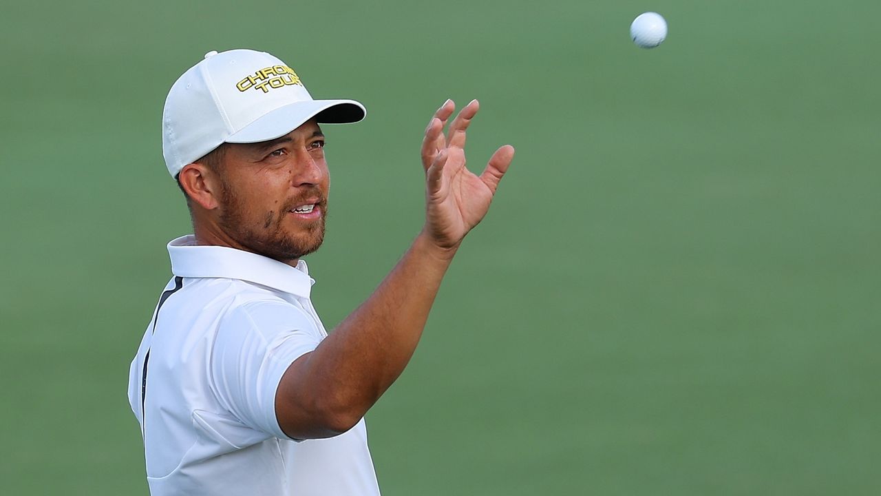  Xander Schauffele of the United States catches his ball on the 12th green during a pro-am prior to The Sentry at Plantation Course at Kapalua Golf Club