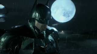Pattinson's The Batman standing in front of the moon