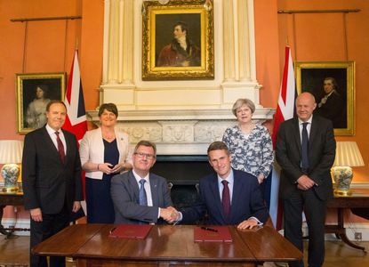 Theresa May and her party sign a governing agreement with Irish unionists