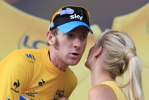 Kisses for Bradley Wiggins on the Tour's leader podium