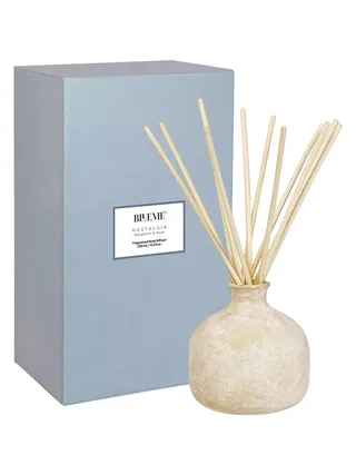 Blueme's Nostalgia Bergamot & Musk Large Diffuser features an earthy, organically shaped packaging in cream and blue.