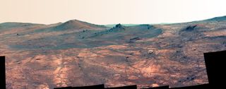 View of “Spirit of St. Louis” crater captured by NASA’s Opportunity Mars rover on March 29 and March 30, 2015. This version of the image is presented in false color to highlight differences in surface materials.