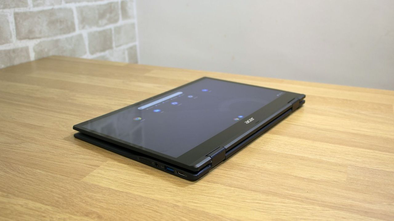 A photograph of the Acer Chromebook Spin 513 flat on a table in tablet mode