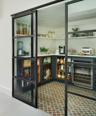 Modern kitchen pantry with steel framed glazing